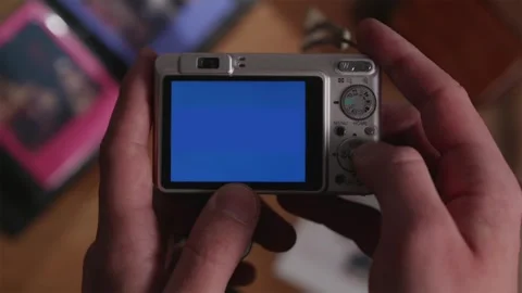 Cinematic top view of retro digital camera blue screen mockup Stock Footage 333765052