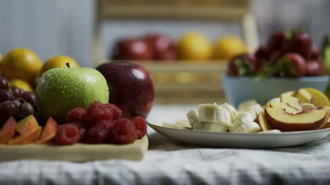 Cinematic tracking shot across kitchen counter with various, delicious fruit Stock Footage 341202439