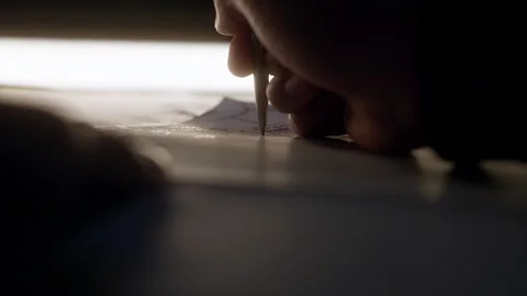 Cinematic Tracking Shot of Hand Writing with a Pen on Paper – 4K Stock Footage 313865618