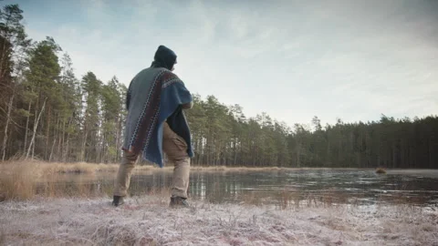 CINEMATIC TRACKING shot of an ice bather doing qigong, tai chi before cold Video stock 166442245