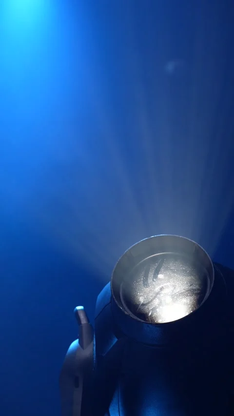 Cinematic vertical close-up of professional stage spotlight lens shining 库存影片 345705547