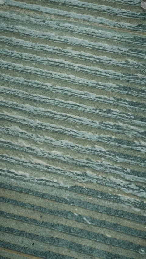 Cinematic vertical close-up shot of clear water flowing down text Vidéo 345458452