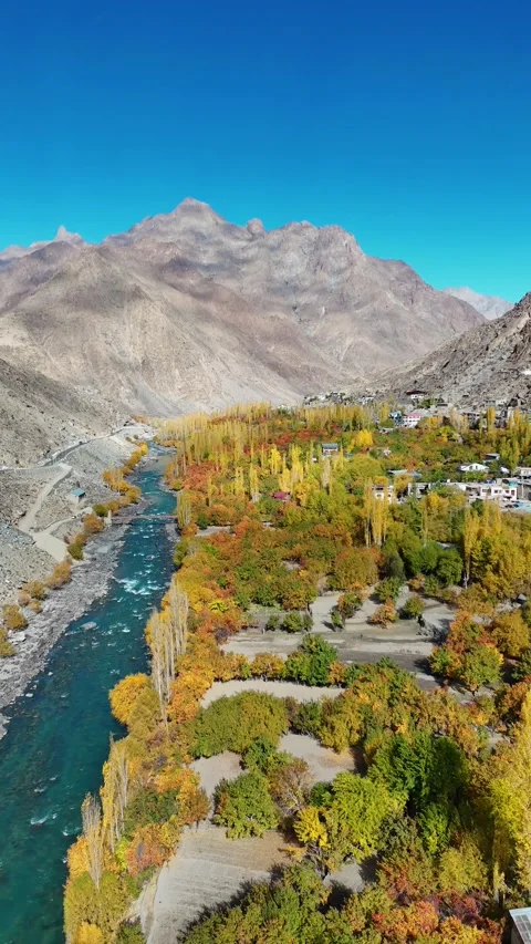 Cinematic vertical drone view of a river road during Kargil’s fall. Stock Footage 310664875