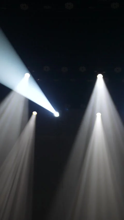 Cinematic vertical pan of multiple powerful white stage spotlights Stock Footage 345705072