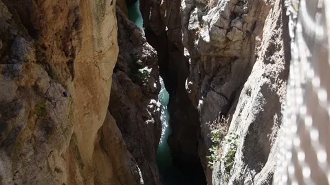 Cinematic vertical pan of the river and Caminito Del Rey walkway Stock Footage 74448623