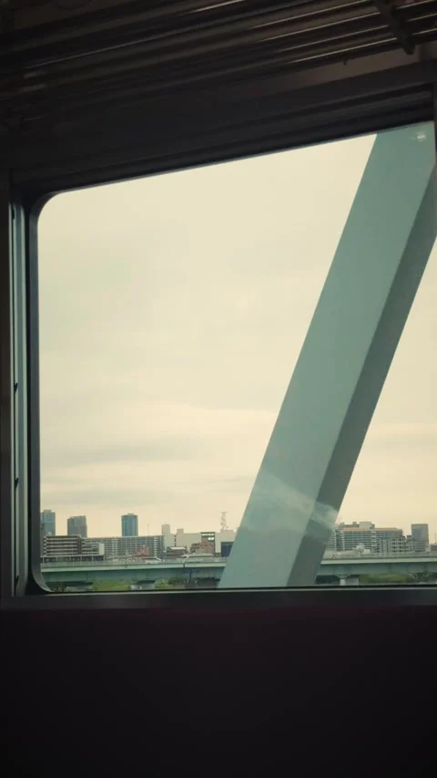 Cinematic vertical shot looking out train window crossing a steel truss Stock Footage 345505376