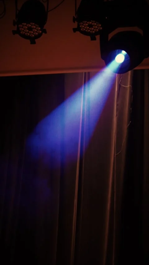 Cinematic vertical view of dramatic blue theatrical spotlight Stock Footage 345700589