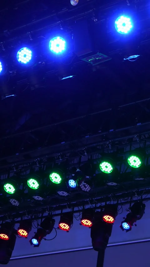 Cinematic vertical view of massive stage lighting rig with flash Stock Footage 345700695