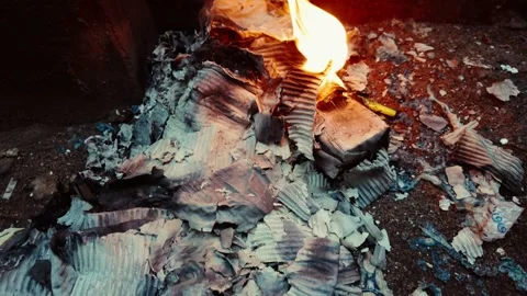 Cinematic video of paper garbage burning in the night 動画素材 342689961