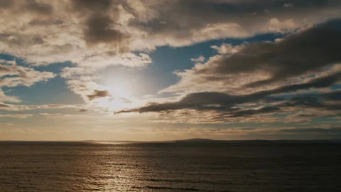 Cinematic view of a beautiful dramatic sea sunset with clouds. Stock Footage 250272691