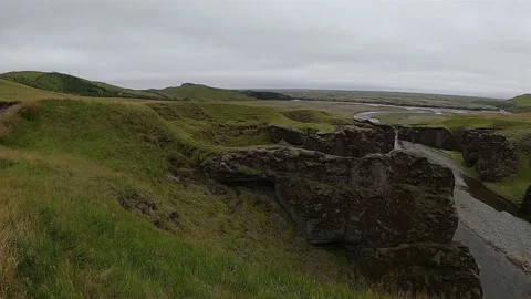 Cinematic view of a deep canyon and rocky river bed in South Iceland Stock Footage 334302966