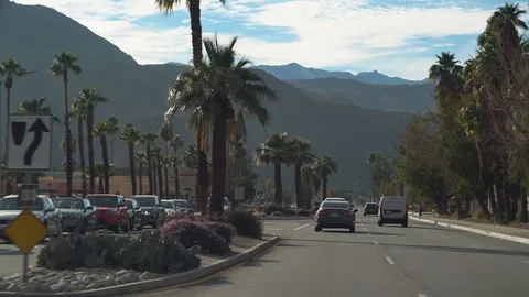 Cinematic view driving on Fred Waring Dr. during the day in Palm Desert Stock Footage 107943557