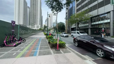 Cinematic View of E-scooters and Construction Site in BGC 4k 60fps Видео 339206404