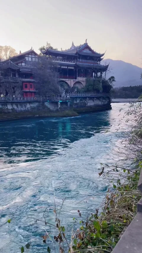 Cinematic View of Flowing Min River and Ancient Architecture in Dujiangyan Stock Footage 329142981
