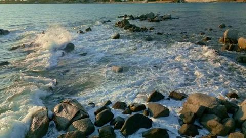 Cinematic view of high tide on rocks in the sea Video stock 241080344
