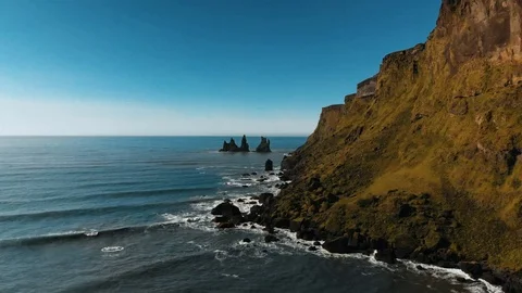 Cinematic view of Icelandic cliffs merging with the ocean Stock Footage 108045503