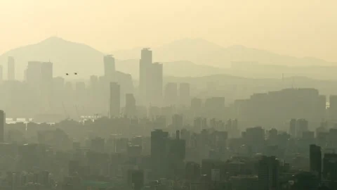 Cinematic view of Seoul in dramatic haze, pair of helicopters fly over city Stock Footage 295056041