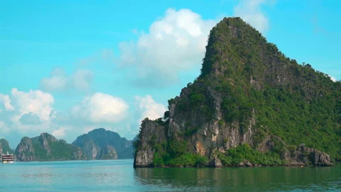 Cinematic View of Sharp Limestone Karst Peaks and Emerald Waters in Ha Long Bay Stock Footage 330978414