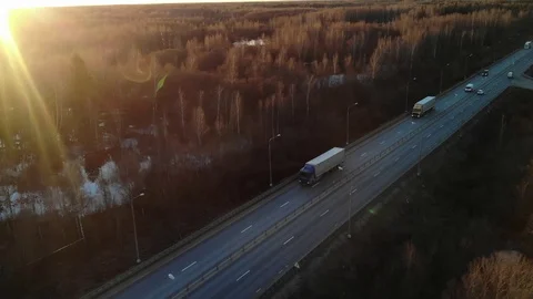 Cinematic view with sunset on the trailer on the highway. Stock Footage 106328699