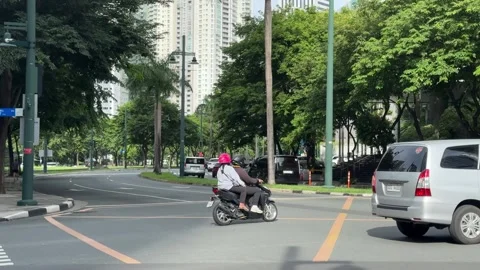 Cinematic View of Traffic in a Modern BGC Street 4k 60fps Stock Footage 339206590