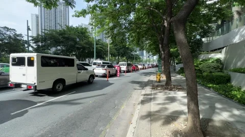 Cinematic View of Traffic in a Modern BGC Street 4k 60fps Stock-Footage 339206745