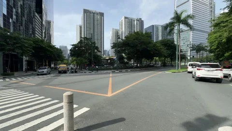 Cinematic View of Traffic in a Modern BGC Street 4k 60fps 動画素材 339206749