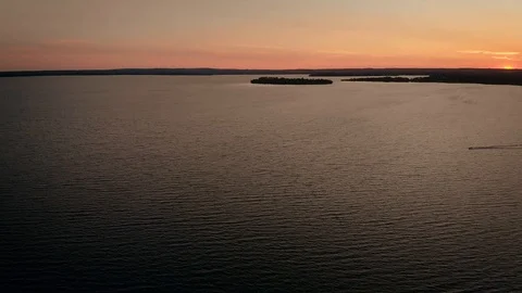 Cinematic view while flying over Mindemoya Lake at sunset, Canada Stock Footage 116040290