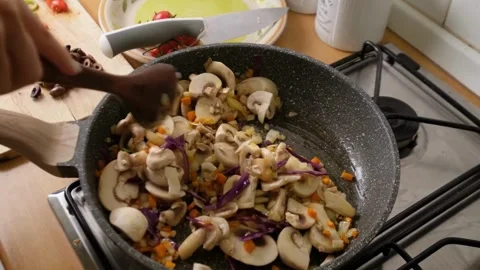 Cinematic View Of Woman Preparing And Cooking Food In Kitchen Stock Footage 323584853