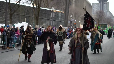 Cinematic vikings walking through St-Patrick's day parade in Quebec City Stock Footage 88633470