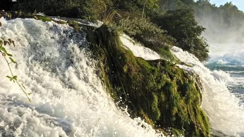 Cinematic waterfall close-up with moss-covered stone, slider movement, 4K Видео 320157419