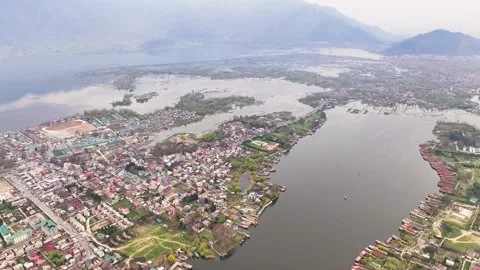 Cinematic wide aerial pullback over Srinagar, revealing the immense scale 16 Stock Footage 333800548