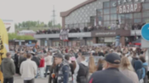 Cinematic wide shot of massive crowd at outdoor festival near buildi Stock Footage 335077836