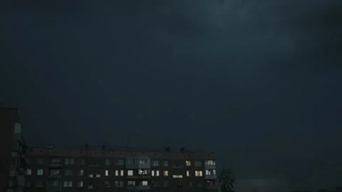 Cinematic wide shot of a massive thunderstorm over a Soviet-style Stock Footage 336863044