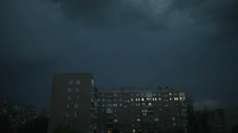 Cinematic wide shot of a massive thunderstorm over a Soviet-style Stock Footage 336863085