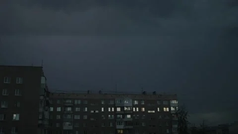 Cinematic wide shot of a massive thunderstorm over a Soviet-style Stock Footage 336863086