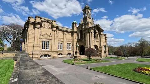 Cinematic wide view of Cartwright Hall Art Gallery in Lister Park, Bradford Stock Footage 333794142