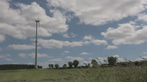 Cinematic Windmill with Foreground Grass in Beautiful Field Stock Footage 325263160