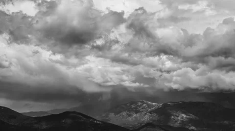 Cinematic zoom out from dramatic looking time lapse of rainy clouds Stock Footage 38242237