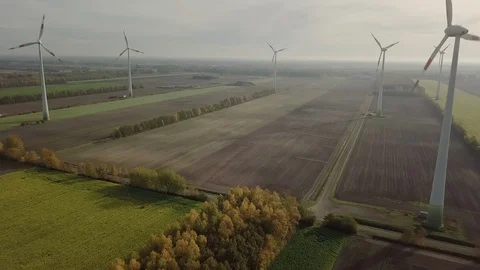 Cinematically Descending Between Wind Turbines Stock Footage 101284140