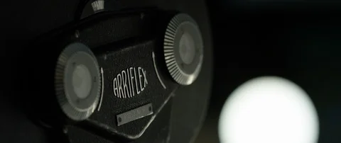 Cinematographer (camera operator) working with a cinema camera at night Stock Footage 100161654