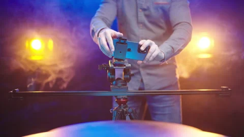 Cinematographer put the Apple iPhone 15 Pro Max on dolly slider 4K Stock Footage 260064694
