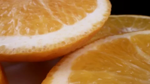 Cinemtic macro view on slices of fresh organic orange, moving closeup shot with 스톡 동영상 236534592