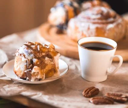 Cinnabon with coffee Stock Photos