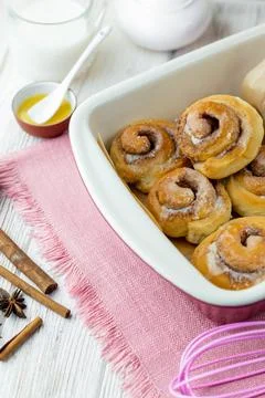 Cinnabon rolls at the baking tray. Stock Photos