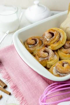 Cinnabon rolls at the baking tray. Stock Photos