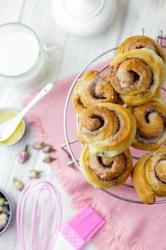 Cinnabon rolls cooling on the grid. Stock Photos