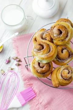 Cinnabon rolls cooling on the grid. Stock Photos