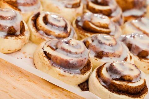 Cinnabons cinnamon rolls on baking paper Stock Photos