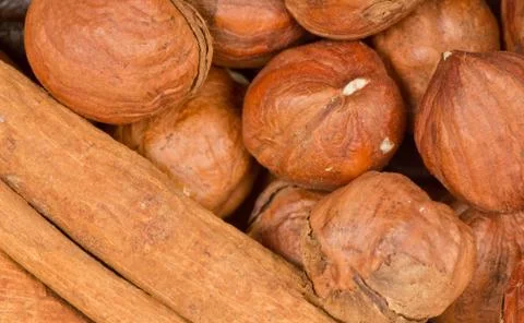 Cinnamon and nuts background Stock Photos