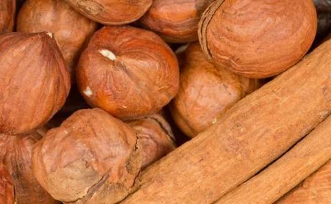 Cinnamon and nuts background Stock Photos